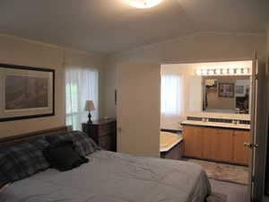 Master Bedroom featuring vaulted ceiling