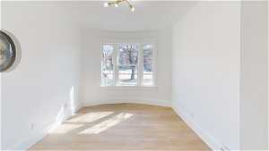 Unit 1 Spare room with hardwood floors and natural light