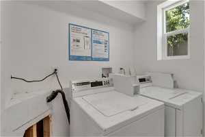 Laundry area featuring natural light and washer / dryer