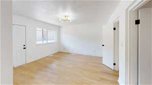 back 6 units Hardwood floored spare room with natural light