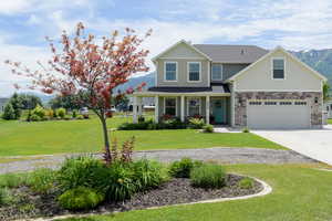 View of front of property with a front yard