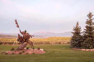 View of yard with a mountain view, a rural view, and fence