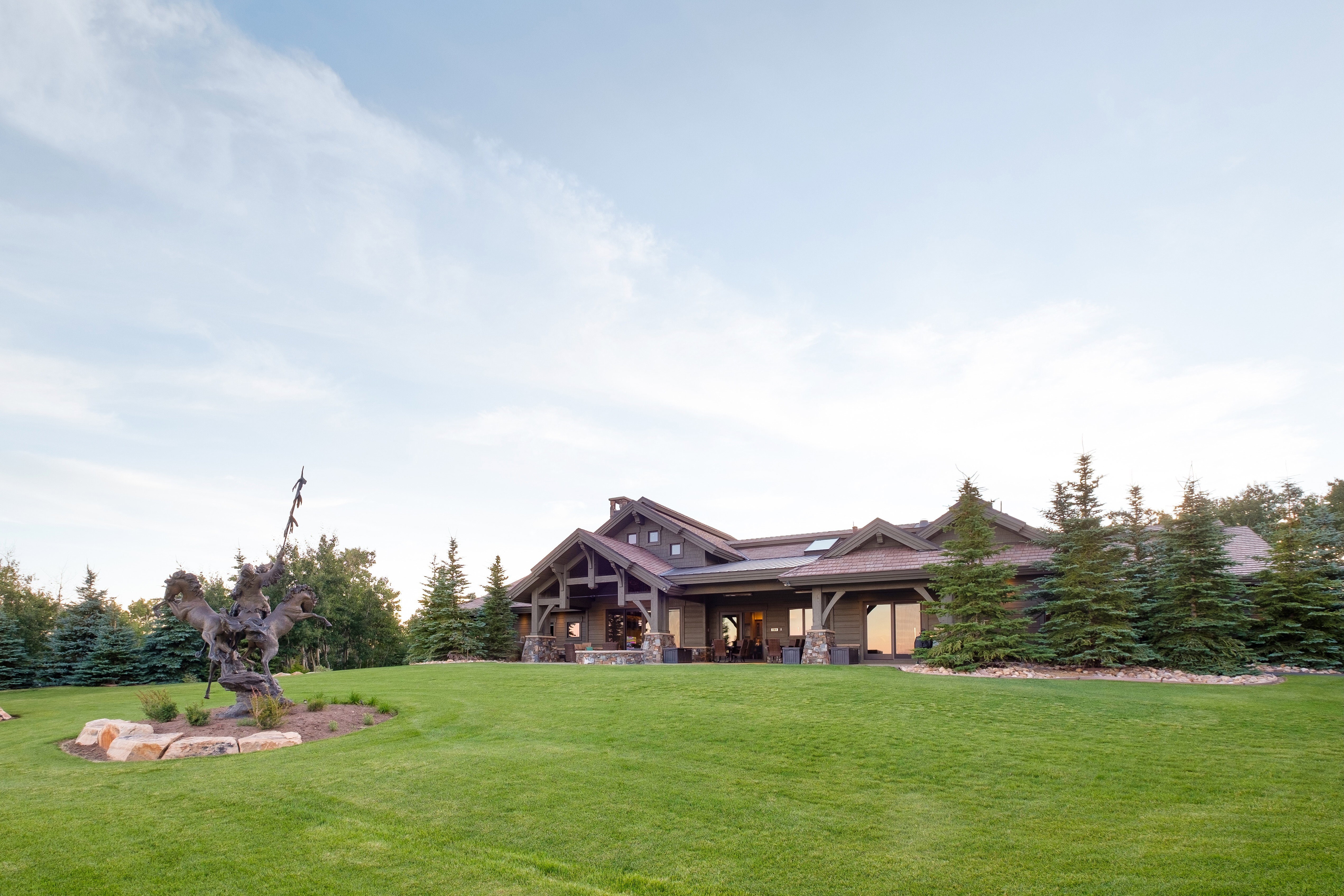 View of front of home featuring covered porch and a front yard