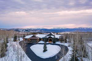Snowy aerial view with a mountain view