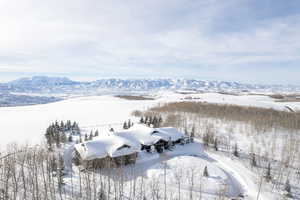 Snowy aerial view with a mountain view