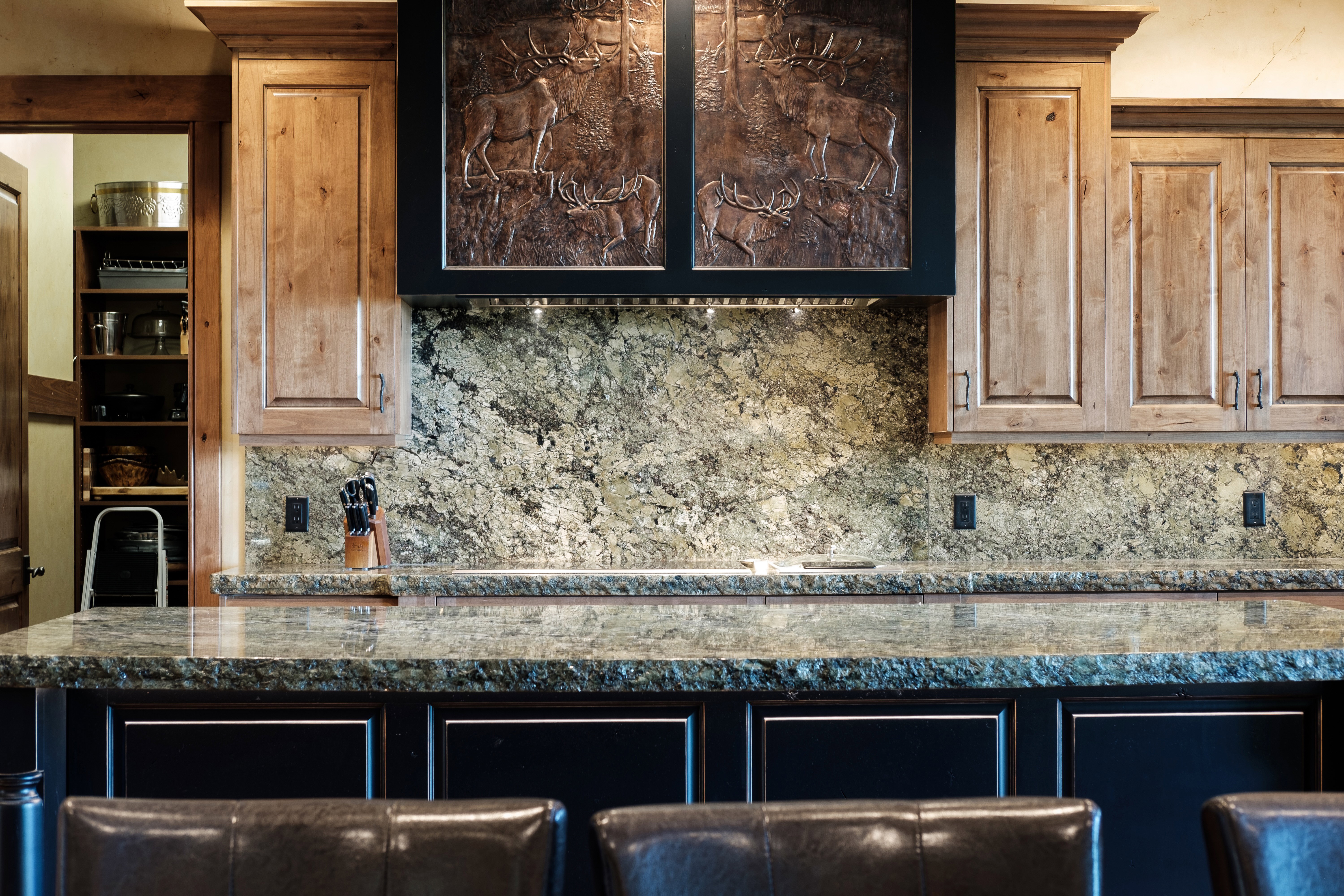 Kitchen with backsplash and dark countertops