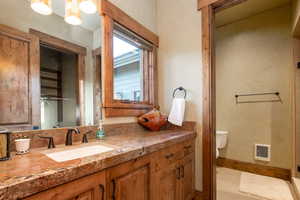 Bathroom featuring vanity and toilet