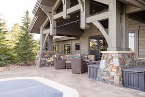 View of patio featuring a balcony and an outdoor hangout area