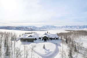 Snowy aerial view with a mountain view