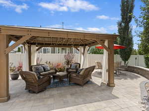 View of patio with an outdoor living space and a pergola