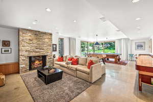 Living room featuring a fireplace and natural light