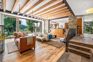 Living room with wood-type flooring and natural light