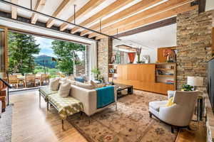 Living room with hardwood flooring and natural light