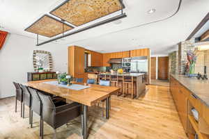 Dining room with a breakfast bar and hardwood floors