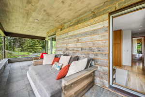 Sunroom with hardwood flooring