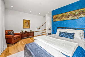 View of hardwood floored bedroom