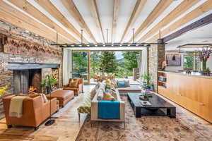 Living room with a fireplace and natural light