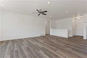 Unfurnished room featuring ceiling fan and light hardwood flooring