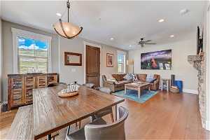 Dining area featuring ceiling fan and light hardwood floors