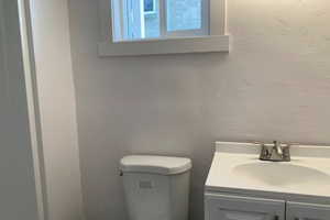 Bathroom featuring mirror and large vanity