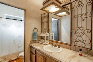 Bathroom featuring vanity and mirror