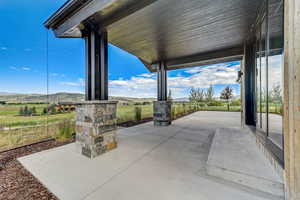 View of patio featuring a rural view and a mountain view