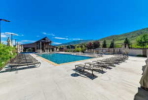 View of swimming pool featuring a patio area and a mountain view