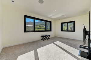 Interior space featuring light colored carpet