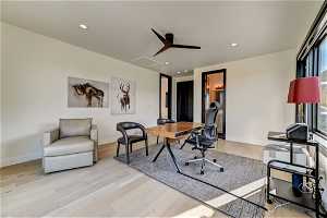 Office featuring ceiling fan and light hardwood / wood-style flooring