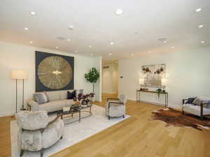 Hardwood floored living room with ornamental molding