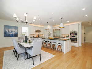 Dining area with light hardwood floors