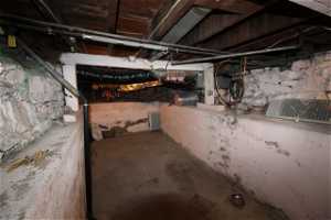 Large "shelf" basement area with tons of additional storage.  Laundry could be moved down here if preferred, freeing up more space in the utility area off the kitchen Also gives great access to the plumbing and electrical for future renovations and founda