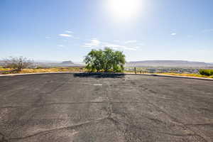 View of parking with a mountain view