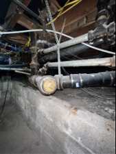 View of basement and home pipes