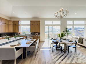 Kitchen featuring a mountain view, a notable chandelier, hanging light fixtures, and light hardwood / wood-style floors