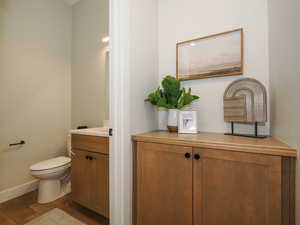 Bathroom with vanity and light hardwood floors