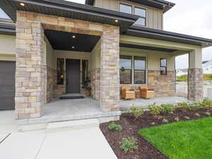 Entrance to property featuring a porch