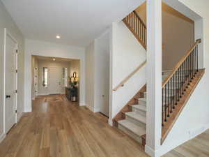 Hall with light hardwood flooring