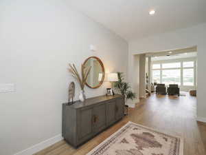 Hallway featuring light hardwood flooring