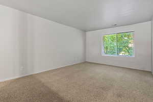 Empty room with carpet flooring