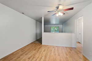 Spare room with light hardwood / wood-style flooring and ceiling fan