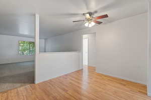 Unfurnished room featuring ceiling fan and light wood-type flooring