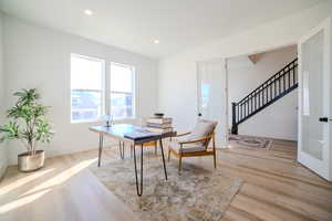 Office area featuring light hardwood / wood-style floors