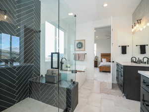 Bathroom featuring vanity, tile floors, and ceiling fan