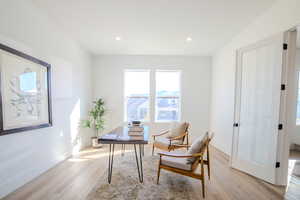 Office with light wood-type flooring