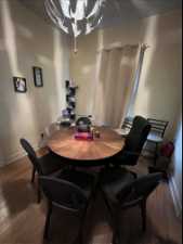 Dining space with hardwood flooring