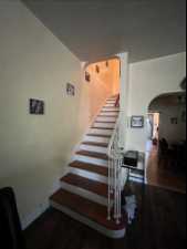 Stairway with dark hardwood floors