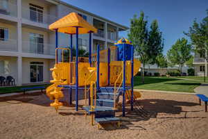 View of jungle gym featuring a yard