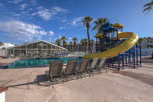 View of swimming pool with a lanai and a patio area