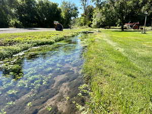 View of water feature flowing in the front yard